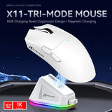 White gaming mouse with RGB charging base on a dark background