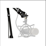 Microphone with stand and pop filter on a white background